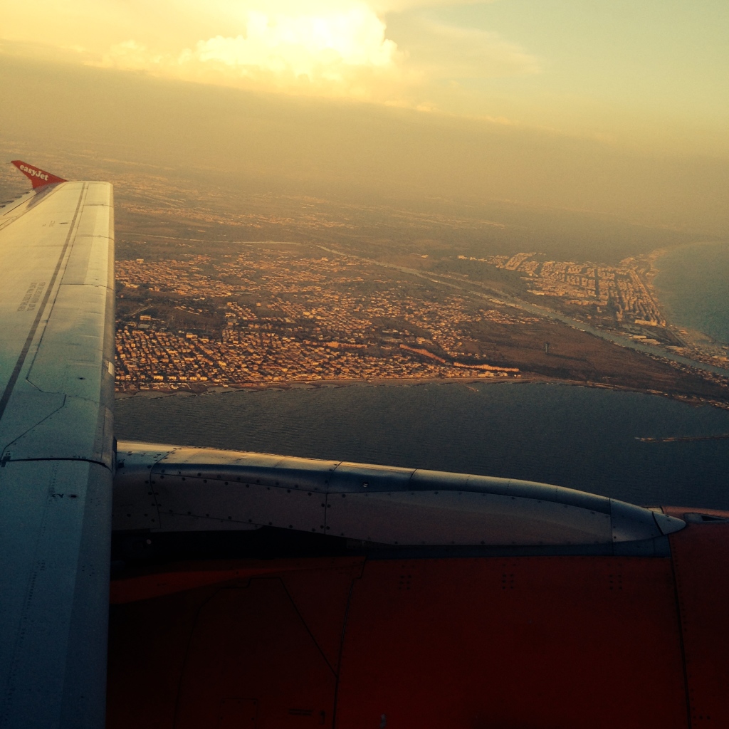 Plane high over the city